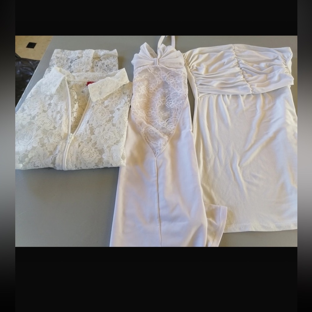 2 mini white dresses. 1 whit lace , the other simple fabric no lace